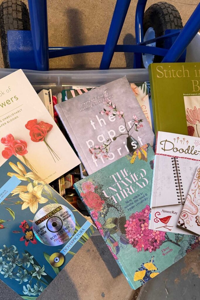 various craft books on a dolly